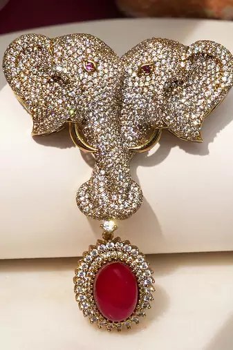 Gold plated ruby red stone twin elephant brooch