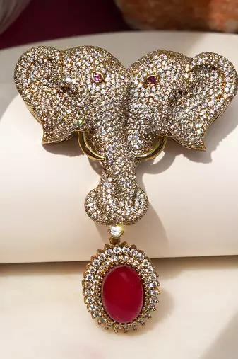 Gold plated ruby red stone twin elephant brooch