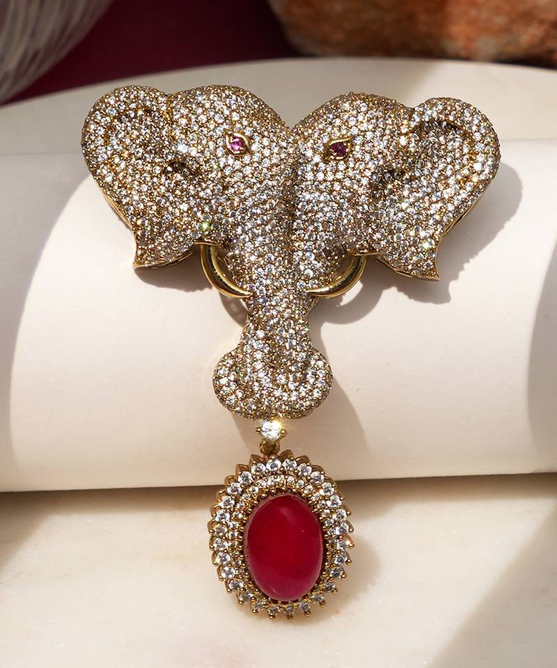 Gold plated ruby red stone twin elephant brooch