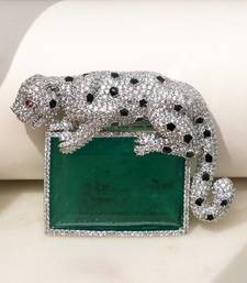 Silver plated green stone crouching leopard brooch