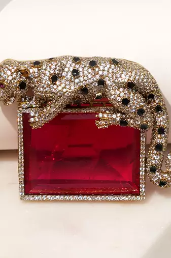 Gold plated ruby red stone crouching leopard brooch