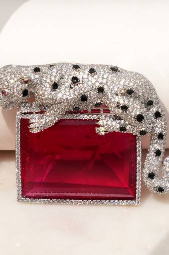 Silver plated ruby red stone crouching leopard brooch