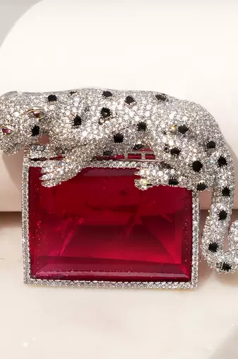 Silver plated ruby red stone crouching leopard brooch