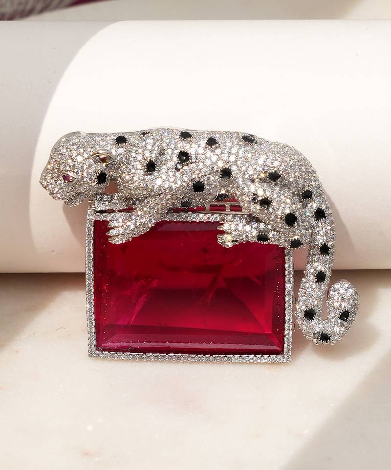 Silver plated ruby red stone crouching leopard brooch