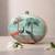 Sea green & gold-toned printed box clutchbag for women with detachable strap