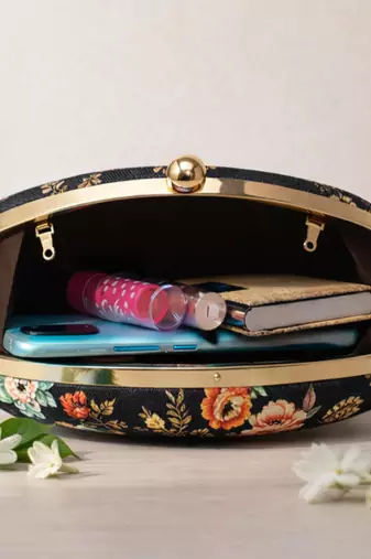 Black & orange floral printed half moon clutch bag for women with detachable strap