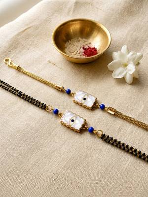 Elegant minimal evil eye bhaiya bhabhi rakhi set with pearl tassels 1
