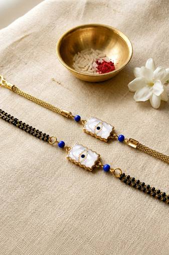 Elegant minimal evil eye bhaiya bhabhi rakhi set with pearl tassels