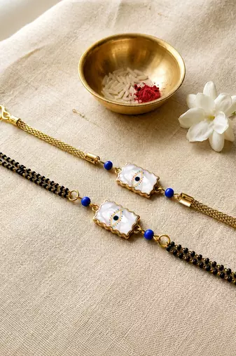 Elegant minimal evil eye bhaiya bhabhi rakhi set with pearl tassels