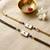 Elegant minimal evil eye bhaiya bhabhi rakhi set with pearl tassels