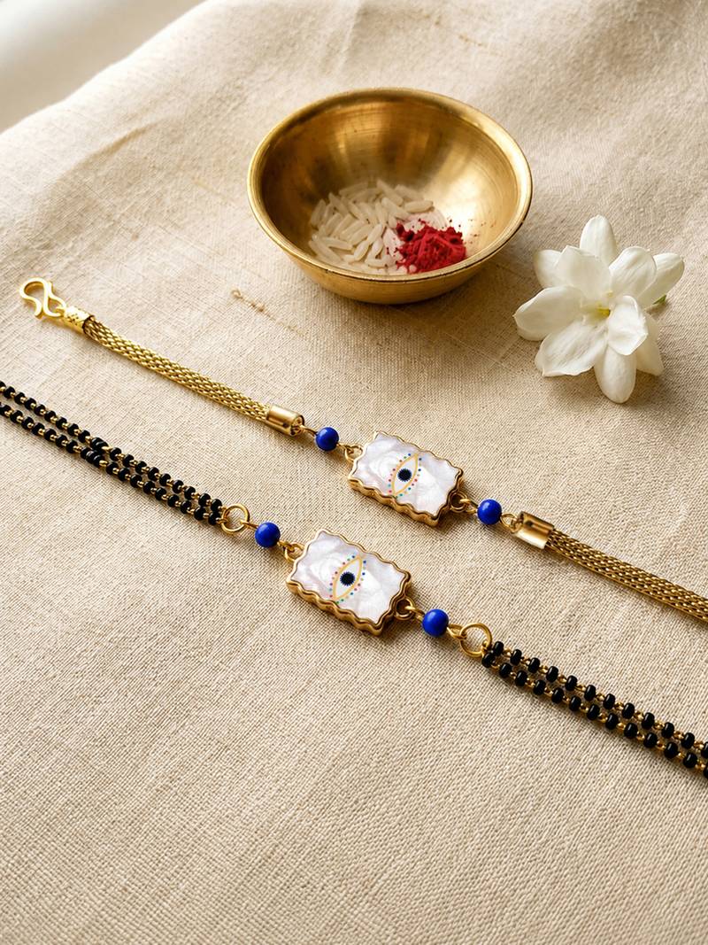 Elegant minimal evil eye bhaiya bhabhi rakhi set with pearl tassels