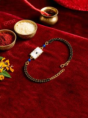 Elegant minimal evil eye bhaiya bhabhi rakhi set with pearl tassels 4