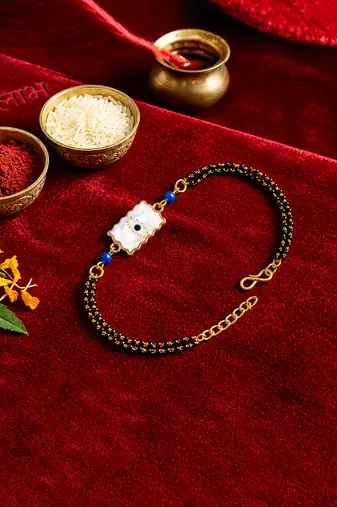 Elegant minimal evil eye bhaiya bhabhi rakhi set with pearl tassels