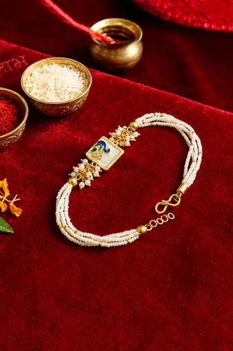Royal peacock bhaiya bhabhi rakhi set with pearl clusters
