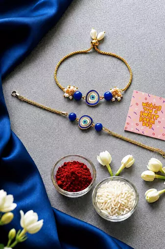 Blue evil eye bhaiya bhabhi rakhi set with pearl tassels