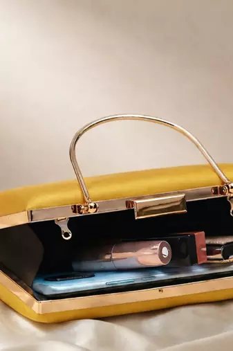 Yellow based classy women printed clutchbag for women with detachable strap