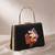 Black based floral lady portrait printed clutch bag for women with detachable strap