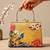 Printed golden songbird garden clutch bag for women with hand embroidery