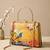 Printed golden songbird garden clutch bag for women with hand embroidery