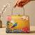 Printed golden songbird garden clutch bag for women with hand embroidery
