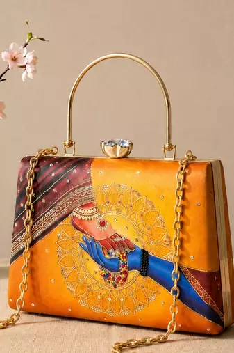 Printed divine hands traditional art clutch with hand embroidery