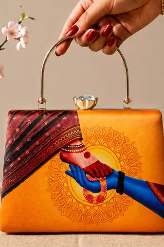 Printed divine hands traditional art clutch with hand embroidery