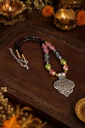 Ethnic heritage two tone pendant necklace