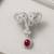 Silver plated ruby red stone twin elephant brooch