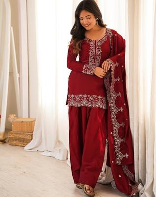 Red silk embroidered kurta set with farshi pant suit 1