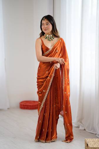 Orange festive trendy satin saree with two tone sequence embroidery