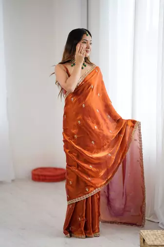 Orange festive trendy satin saree with two tone sequence embroidery