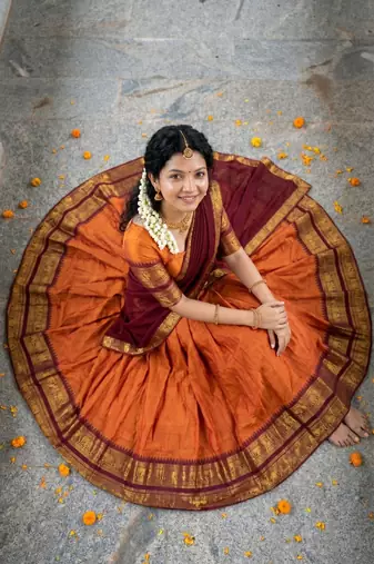 Women’s Orange and Maroon Traditional Half Saree Lehenga with Golden Woven Border