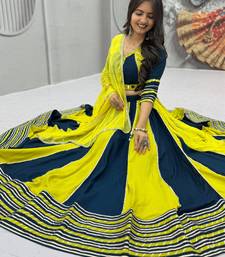 NAVRATRI YELLOW-TEAL BLUE SOLID FLARED LEHENGA SET