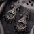 Oxidized silver-tone statement chandelier earrings with black stone accents