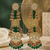 Antique gold kundan polki long jhumka earrings with green beads & pearl drops