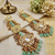 Antique gold kundan polki long jhumka earrings with mint beads & pearl drops