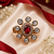 Ruby Glow Gold Finish Adjustable Ring