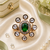 Emerald glow gold finish adjustable ring