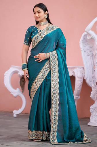 Fashionable teal blue embroidered border fandy satin saree with unstitched blouse