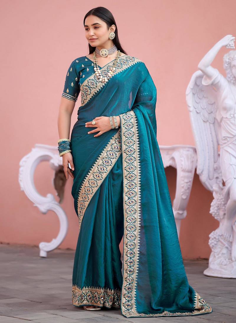 Fashionable teal blue embroidered border fandy satin saree with unstitched blouse