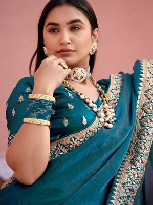Fashionable teal blue embroidered border fandy satin saree with unstitched blouse 3