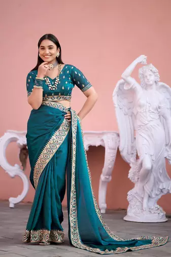 Fashionable teal blue embroidered border fandy satin saree with unstitched blouse