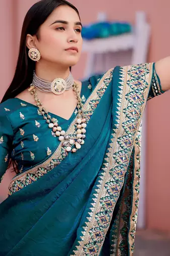 Fashionable teal blue embroidered border fandy satin saree with unstitched blouse