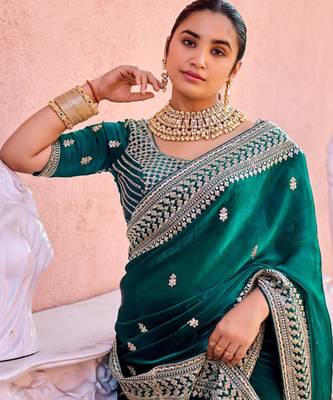 Trendy teal blue zari jaal embroidery heavy border fancy satin saree with unstitched blouse 5