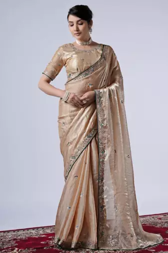 Celebrity inspired cream embroiderd border satin saree with unstitched blouse