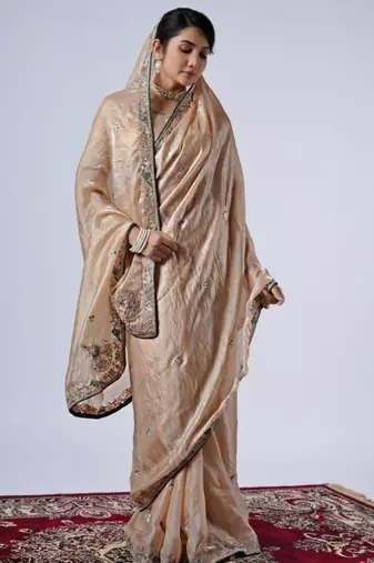 Celebrity inspired cream embroiderd border satin saree with unstitched blouse