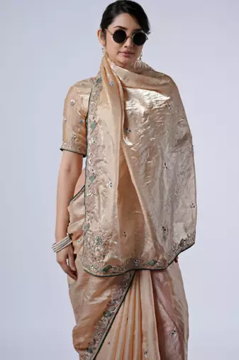 Celebrity inspired cream embroiderd border satin saree with unstitched blouse