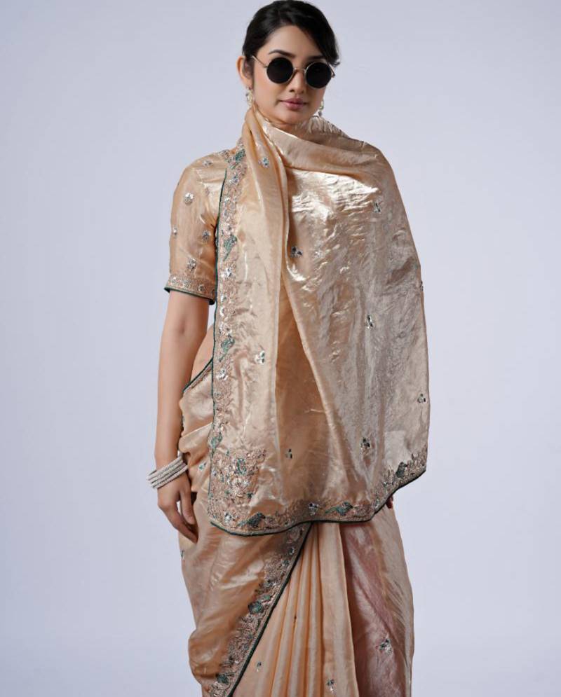 Celebrity inspired cream embroiderd border satin saree with unstitched blouse