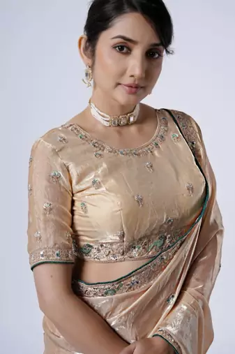 Celebrity inspired cream embroiderd border satin saree with unstitched blouse