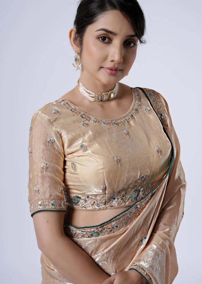 Celebrity inspired cream embroiderd border satin saree with unstitched blouse